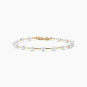 The 14K Yellow Gold Fresh Water Pearl Station Bracelet features a delicate design with evenly spaced pearls and a gold lobster clasp, displayed on a plain white background.