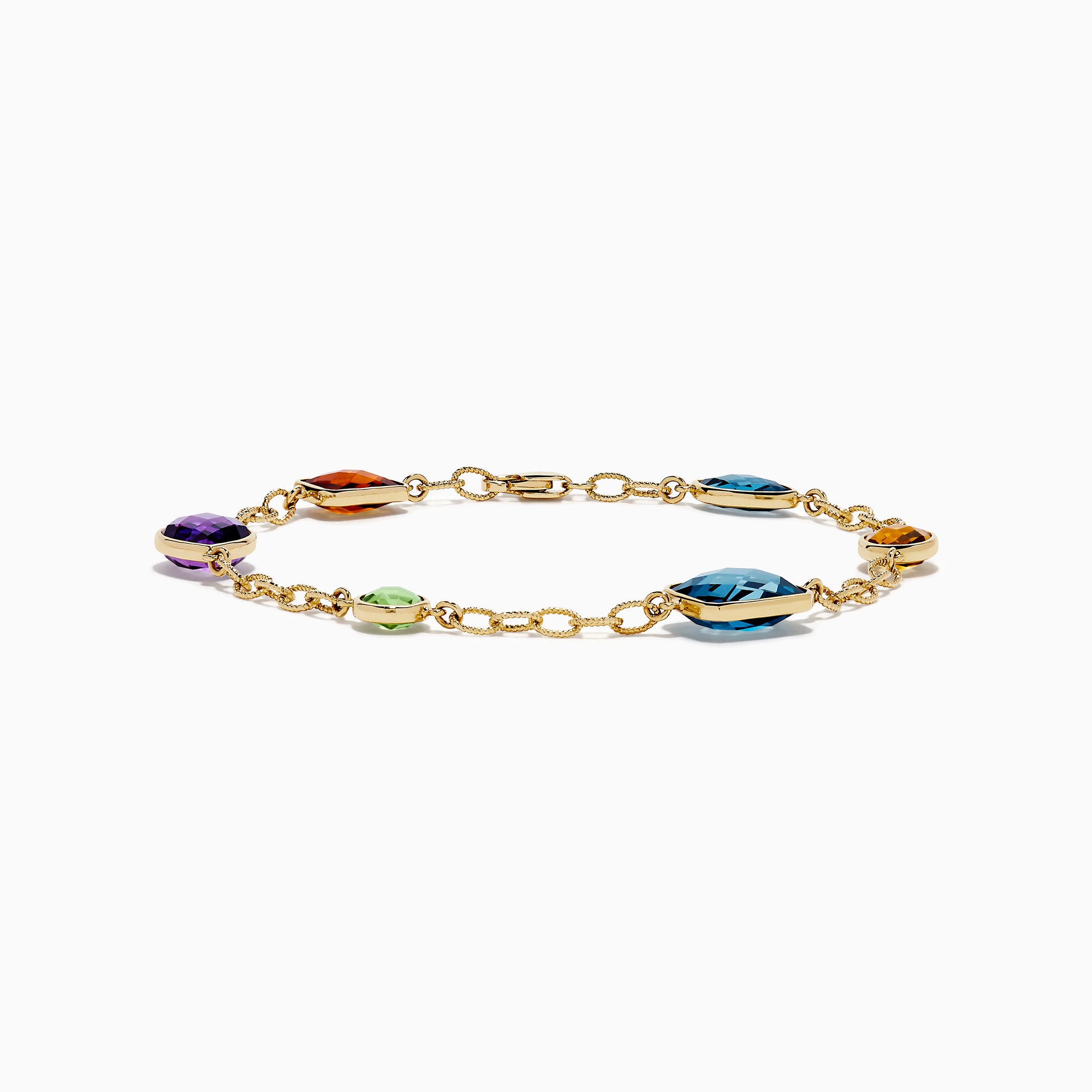 The Mosaic 14K Yellow Gold Multi Gemstone Station Bracelet features five colorful gemstones—blue, green, orange, red, and purple—in various shapes along a gold chain. Shown on a white background, it’s a vibrant accessory for any occasion.