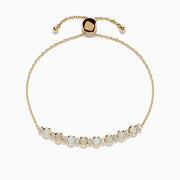 The Aurora 14K Yellow Gold Opal Bolo Bracelet 1.81 TCW features eight opal stones in a row, a sliding clasp, and gold bead accents for a delicate, elegant look.