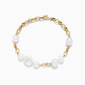The 14K Yellow Gold Fresh Water Pearl Chain Link Bracelet features five irregular freshwater pearls evenly spaced on a delicate gold chain, finished with a secure lobster clasp.