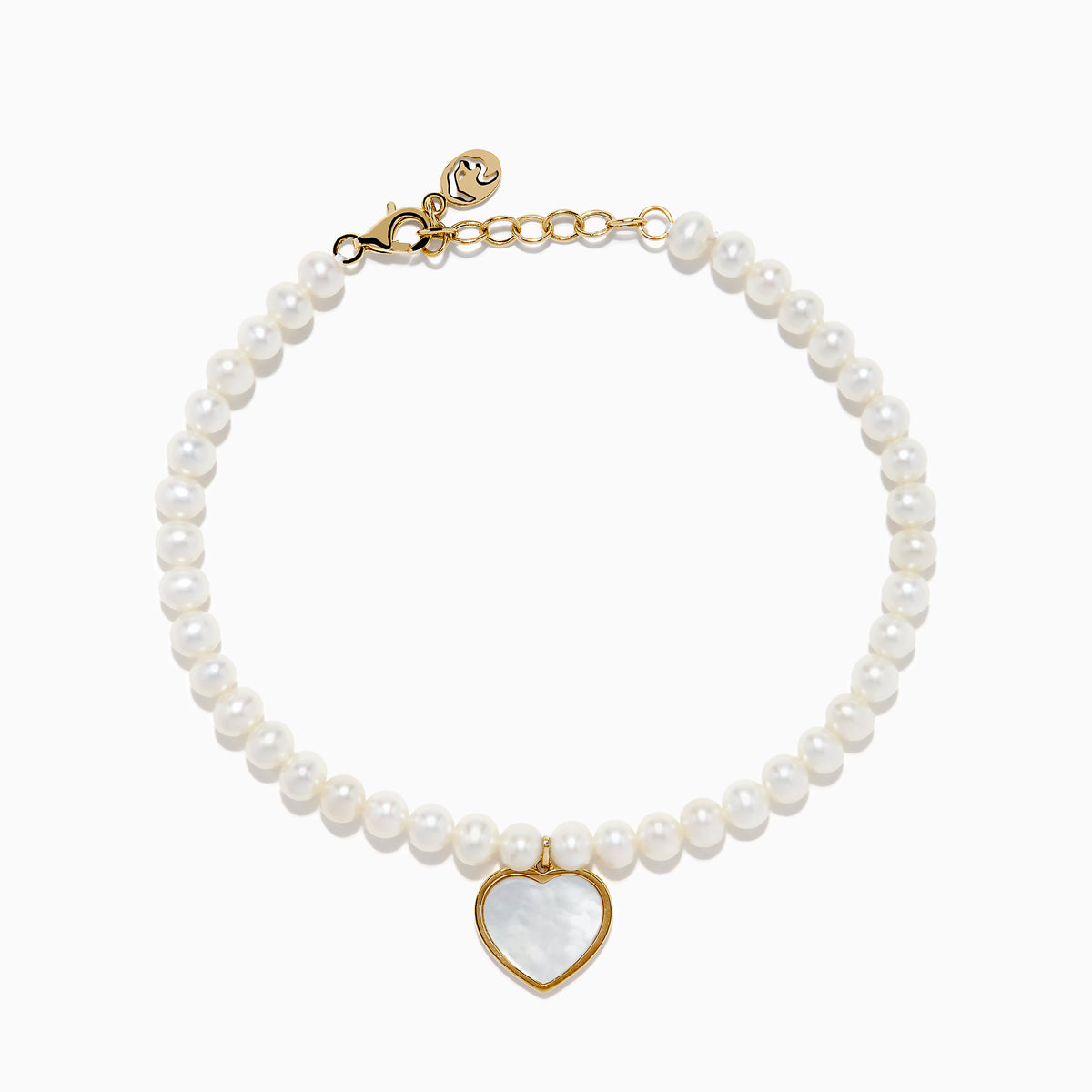 The 14K Gold Fresh Water Pearl and Mother of Pearl Heart Charm Bracelet features a gold clasp and extender, with a heart charm outlined in gold and filled with iridescent mother of pearl, shown against a white background.