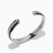 The Mens 925 Sterling Silver Leather Bangle features a diagonal rope-like pattern with dark accents along the edges and is displayed on a white background.