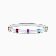The Mosaic 925 Sterling Silver Multicolor Gemstone Bangle features five rectangular orange, red, purple, blue, and green gemstones evenly spaced around the band, shown on a white background.