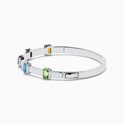 The Mosaic 925 Sterling Silver Multicolor Gemstone Bangle features five rectangular orange, red, purple, blue, and green gemstones evenly spaced around the band, shown on a white background.