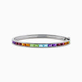 The 925 Sterling Silver Baguette Multi Color Gemstone Bangle showcases a row of vibrant rainbow-hued gemstones set along the front.