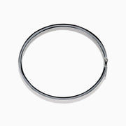 The 925 Sterling Silver Baguette Multi Color Gemstone Bangle showcases a row of vibrant rainbow-hued gemstones set along the front.
