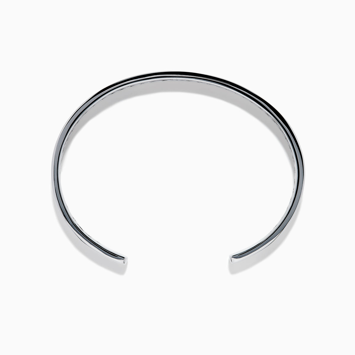 The Men's 925 Sterling Silver and Blue Sapphire Bracelet features a row of blue sapphires at the center and black chevron accents on the edges, offering a bold update to the classic blue sapphire bracelet.