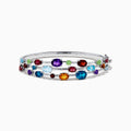 The 925 Sterling Silver Multi Color Gemstone 3 Row Statement Bangle showcases vibrant blue, red, purple, green, and orange stones in various shapes and sizes—a bold accessory for any jewelry collection.