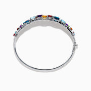 The 925 Sterling Silver Multi Color Gemstone 3 Row Statement Bangle showcases vibrant blue, red, purple, green, and orange stones in various shapes and sizes—a bold accessory for any jewelry collection.