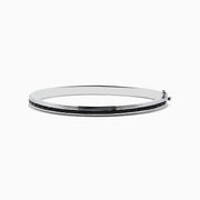 The 925 Sterling Silver Black Spinel Bangle features a sleek design with a row of rectangular black spinel stones set along the center.