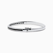 The 925 Sterling Silver Black Spinel Bangle features a sleek design with a row of rectangular black spinel stones set along the center.