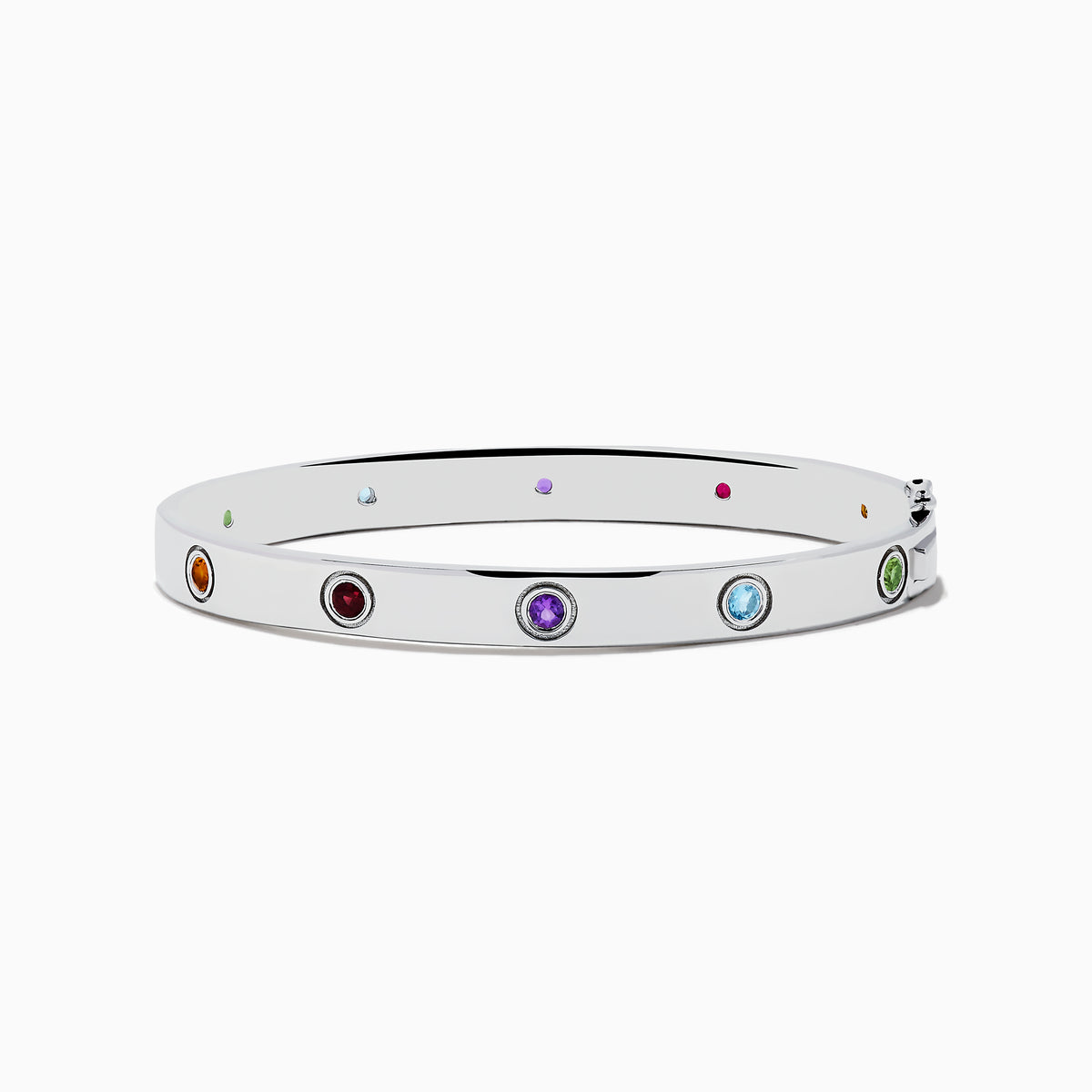 The 925 Sterling Silver Multi Gemstone and Diamond Bangle features small, round gemstones in vibrant red, purple, green, blue, and orange hues set evenly along a sleek silver band.
