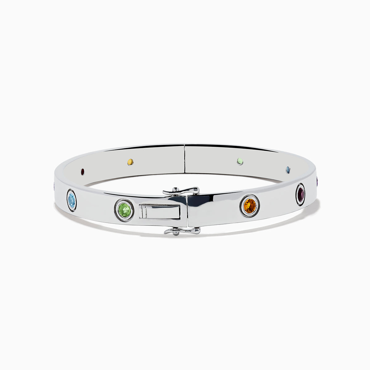 The 925 Sterling Silver Multi Gemstone and Diamond Bangle features small, round gemstones in vibrant red, purple, green, blue, and orange hues set evenly along a sleek silver band.