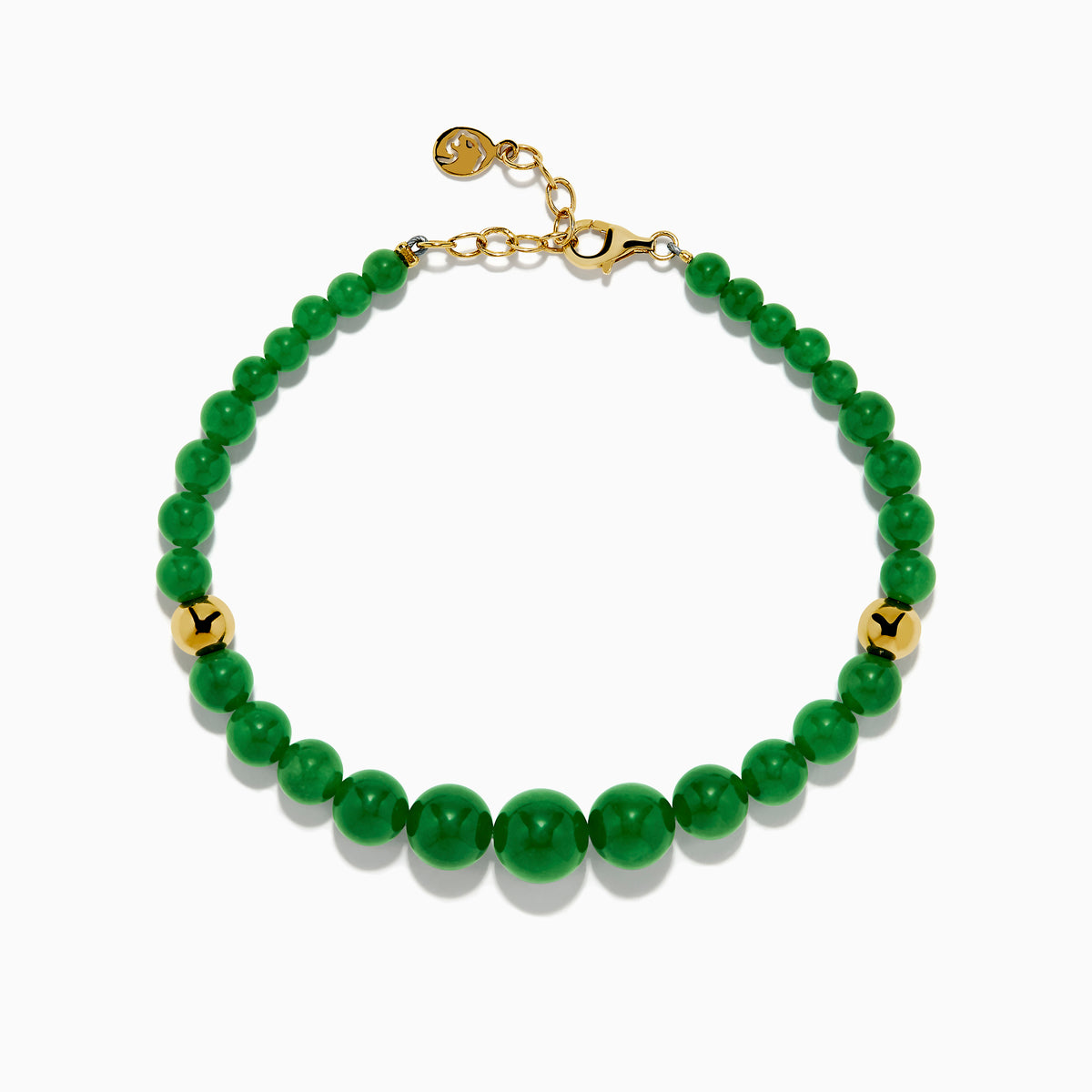 The 14K Yellow Gold Graduated Jade Bracelet features glossy green round jade beads, two 14K yellow gold beads, a gold clasp, and a small gold smiley face charm near the closure.