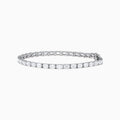 A Lab Grown Emerald Cut Diamond 7.50ct Tennis Bracelet in 14K White Gold is shown, featuring a continuous row of rectangular lab grown diamonds on a plain white background.