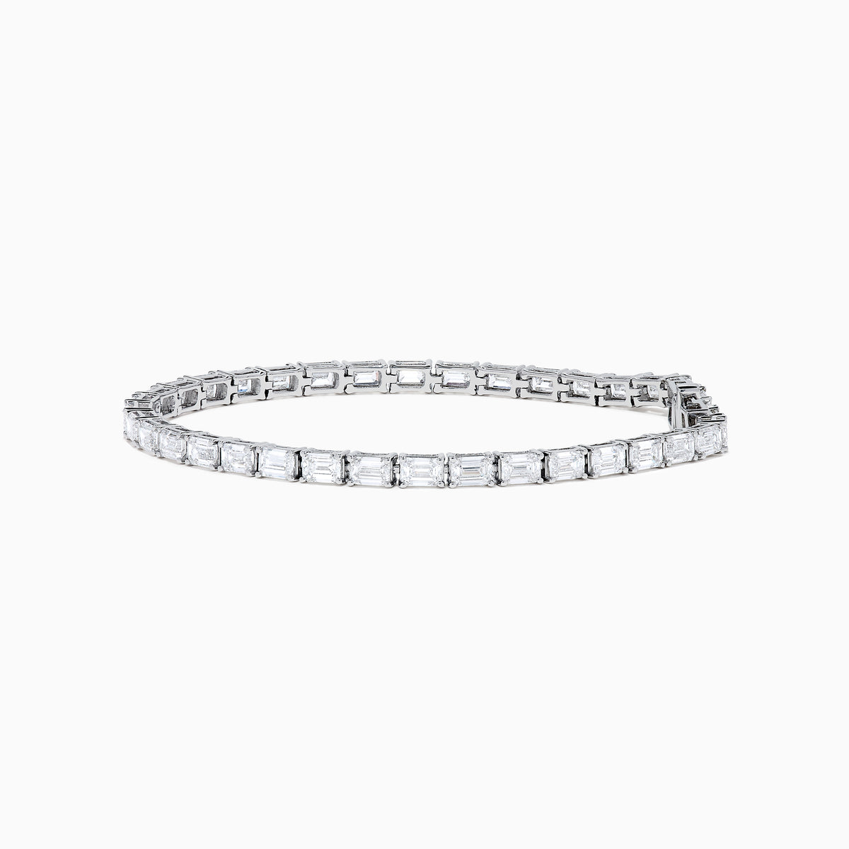 A Lab Grown Emerald Cut Diamond 7.50ct Tennis Bracelet in 14K White Gold is shown, featuring a continuous row of rectangular lab grown diamonds on a plain white background.