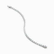 A Lab Grown Emerald Cut Diamond 7.50ct Tennis Bracelet in 14K White Gold is shown, featuring a continuous row of rectangular lab grown diamonds on a plain white background.