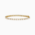 The Lab Grown Emerald Cut Diamond 7.50ct Tennis Bracelet in 14K Yellow Gold features a single row of rectangular lab-grown diamonds, elegantly set and displayed on a plain white background.