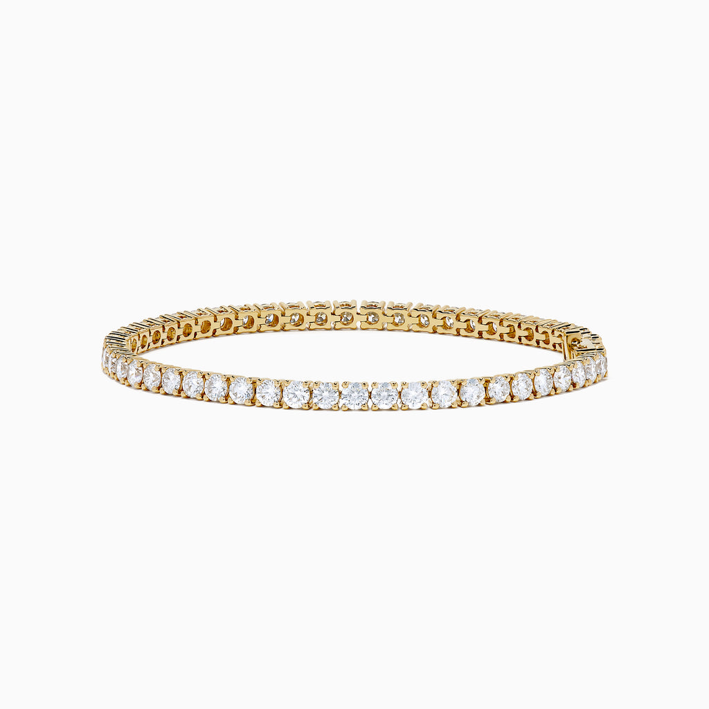 The Lab Grown Round Diamond 7.00ct Tennis Bracelet in 14K Yellow Gold showcases a single row of sparkling lab-grown diamonds set in a continuous line of yellow gold, displayed against a white background.