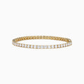 The Lab Grown Round Diamond 7.00ct Tennis Bracelet in 14K Yellow Gold showcases a single row of sparkling lab-grown diamonds set in a continuous line of yellow gold, displayed against a white background.
