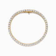 The Lab Grown Round Diamond 7.00ct Tennis Bracelet in 14K Yellow Gold showcases a single row of sparkling lab-grown diamonds set in a continuous line of yellow gold, displayed against a white background.