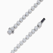 The Lab Grown Round Diamond 5.00ct Cupcake Setting Tennis Bracelet in 14K White Gold features a slender band adorned with a continuous row of sparkling lab grown diamonds.
