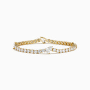 The Lab Grown Pear and Round Diamond 10.00ct Tennis Bracelet in 14K Yellow Gold features a striking, symmetrical design and secure clasp—a stunning alternative to traditional diamond bracelets.
