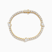 The Lab Grown Pear and Round Diamond 10.00ct Tennis Bracelet in 14K Yellow Gold features a striking, symmetrical design and secure clasp—a stunning alternative to traditional diamond bracelets.
