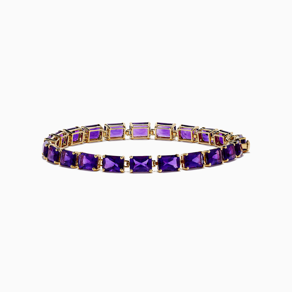 The 14K Yellow Gold Radiant Cut Amethyst Tennis Bracelet showcases a row of radiant cut amethysts in prong settings, displayed against a white background.