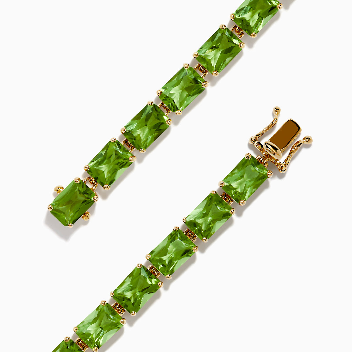 The 14K Yellow Gold Radiant Cut Peridot Tennis Bracelet features rectangular green peridot gemstones evenly spaced and connected, displayed on a white background.
