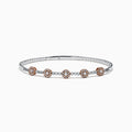 The 14K Two-Tone Gold Pink and White Diamond Flexible Bangle features round pink and white diamond clusters linked on a slender, polished band—a modern, refined update on the classic diamond bangle.