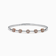 The 14K Two-Tone Gold Pink and White Diamond Flexible Bangle features round pink and white diamond clusters linked on a slender, polished band—a modern, refined update on the classic diamond bangle.