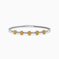 The Canare Platinum and 18K Yellow Gold Yellow and White Diamond Bangle features five oval yellow gold accents, each set with yellow diamonds, spaced along clear square-cut white diamonds for a sleek, elegant look.