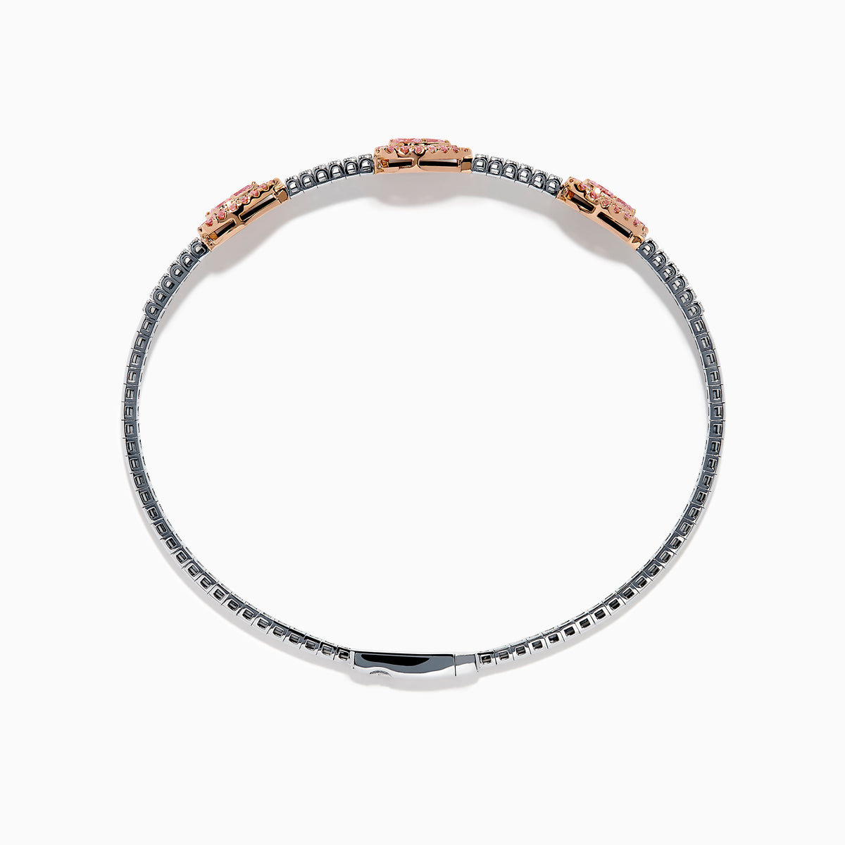 This Platinum and 14K Rose Gold Pink and White Diamond Bangle features three teardrop-shaped pink gemstone clusters framed by diamonds, creating an elegant look with evenly spaced gems along its slender silver-toned band.