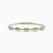 The Aurora 14K Yellow Gold Opal and Diamond Bangle features five square opals in a row, accented with small white diamonds between each stone, shown on a white background.