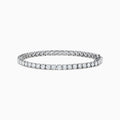 The 14K White Gold 7.00 Carat Lab Grown Diamond Tennis Bracelet features a continuous row of sparkling round-cut lab-grown diamonds, beautifully showcased against a plain white background.