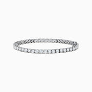 The 14K White Gold 7.00 Carat Lab Grown Diamond Tennis Bracelet features a continuous row of sparkling round-cut lab-grown diamonds, beautifully showcased against a plain white background.
