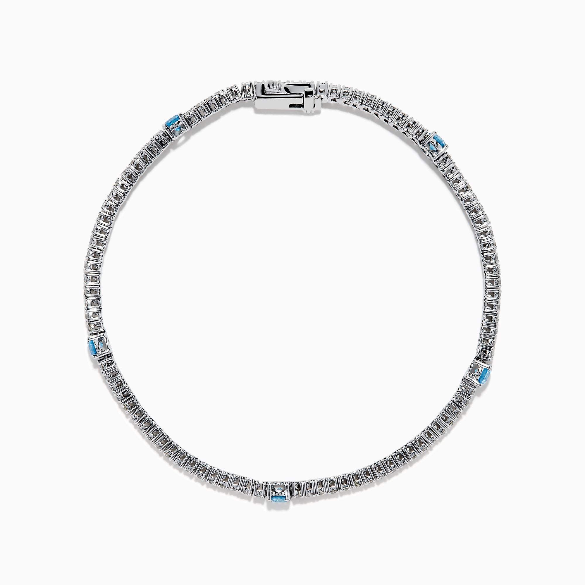 The Lab Grown Blue and White Diamond Tennis Station Bracelet in 14K white gold features clear lab grown diamonds with three evenly spaced round blue gemstones, shown displayed on a white background.