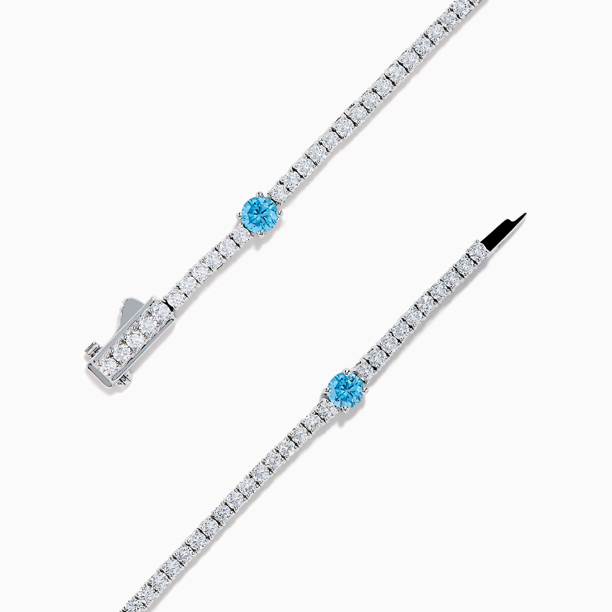 The Lab Grown Blue and White Diamond Tennis Station Bracelet in 14K white gold features clear lab grown diamonds with three evenly spaced round blue gemstones, shown displayed on a white background.