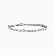 The Lab Grown Diamond Tennis Bracelet in 14K White Gold features a row of round and marquise-cut stones set in a continuous line, creating an elegant and timeless look.
