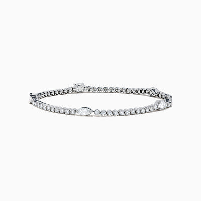 The Lab Grown Diamond Tennis Bracelet in 14K White Gold features a row of round and marquise-cut stones set in a continuous line, creating an elegant and timeless look.