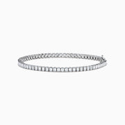 The Lab Grown Emerald Cut Diamond 4.26ct Tennis Bracelet in 14K White Gold features a single row of lab grown diamonds, set in a sleek white gold band and showcased on a plain white background.
