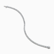 The Lab Grown Emerald Cut Diamond 4.26ct Tennis Bracelet in 14K White Gold features a single row of lab grown diamonds, set in a sleek white gold band and showcased on a plain white background.