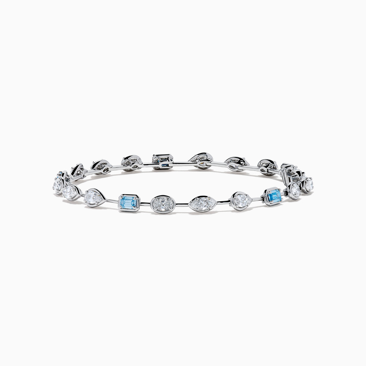 The Lab Grown Blue and White Diamond Multi Shape Tennis Bracelet in 14K White Gold showcases alternating oval, round, and emerald-cut lab-grown blue and white diamonds against a white background.