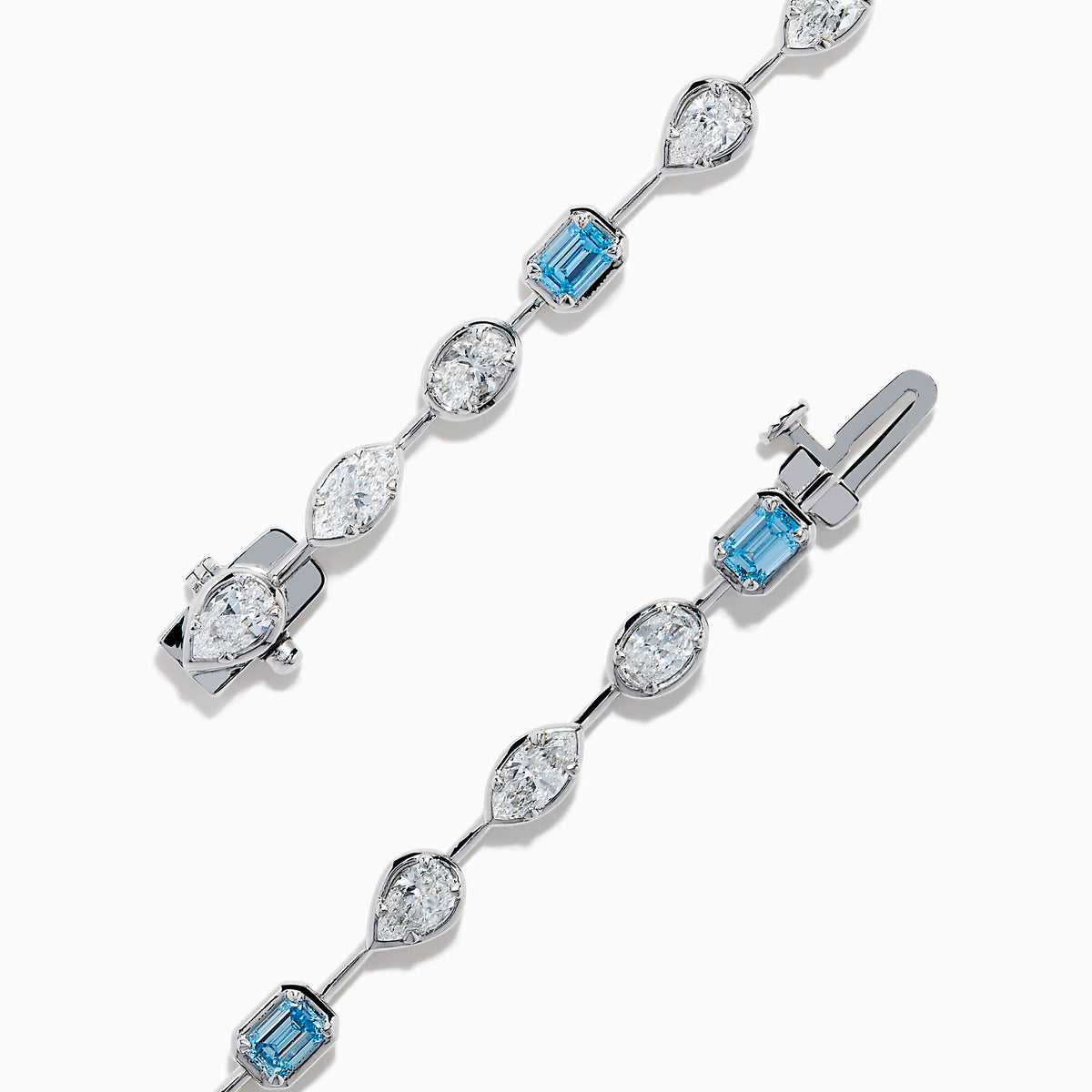The Lab Grown Blue and White Diamond Multi Shape Tennis Bracelet in 14K White Gold showcases alternating oval, round, and emerald-cut lab-grown blue and white diamonds against a white background.