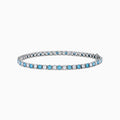 The Lab Grown Blue and White Diamond Tennis Bracelet in 14K White Gold features alternating round blue and white diamonds set in a continuous line, shown against a white background.