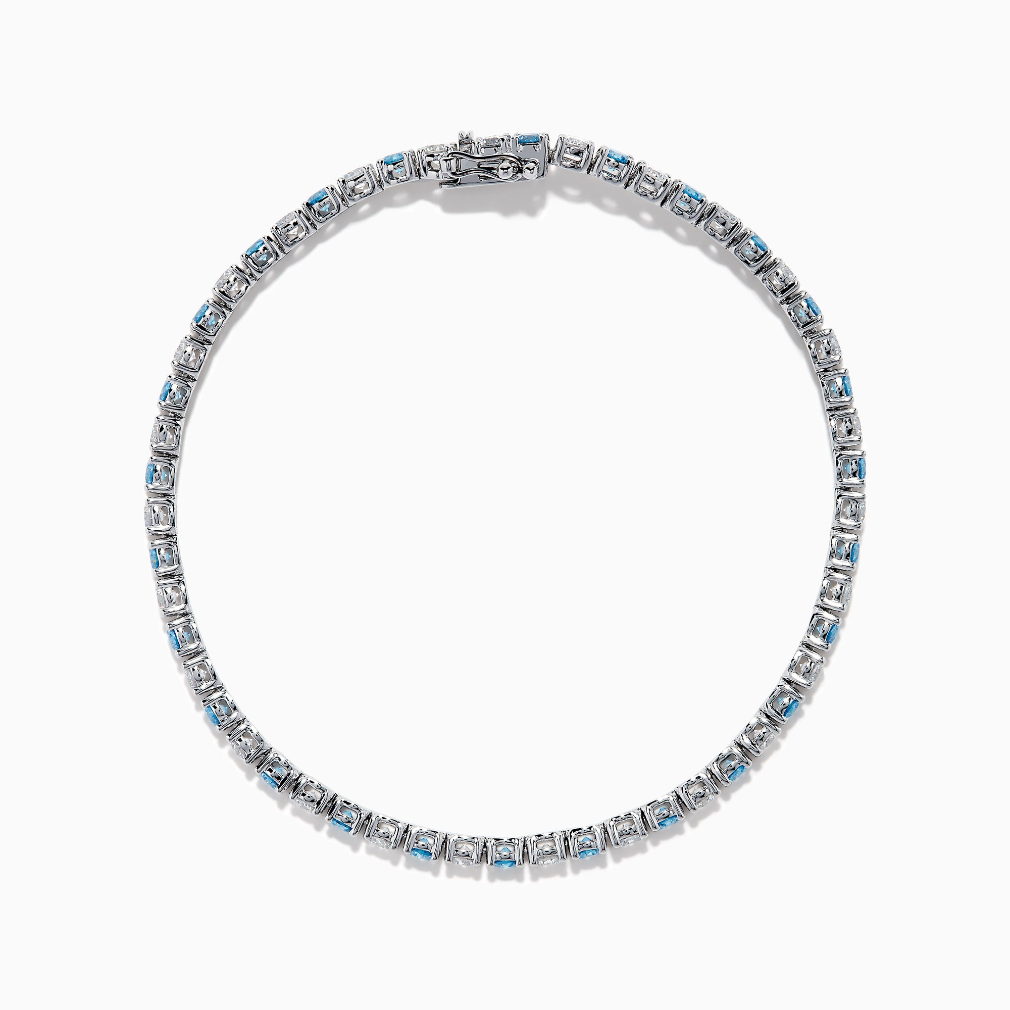 The Lab Grown Blue and White Diamond Tennis Bracelet in 14K White Gold features alternating round blue and white diamonds set in a continuous line, shown against a white background.