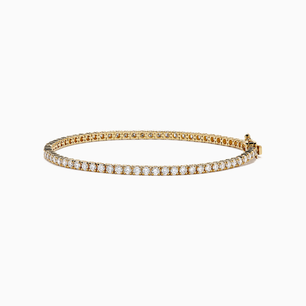 The Lab Grown Diamond 2.95ct Tennis Bracelet in 14K Yellow Gold showcases a continuous line of round lab grown diamonds in prong settings, beautifully displayed against a plain white background.