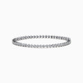The 14K White Gold Diamond Miracle Setting Tennis Bracelet features a continuous line of round-cut diamonds set in white gold, displayed against a plain white background.