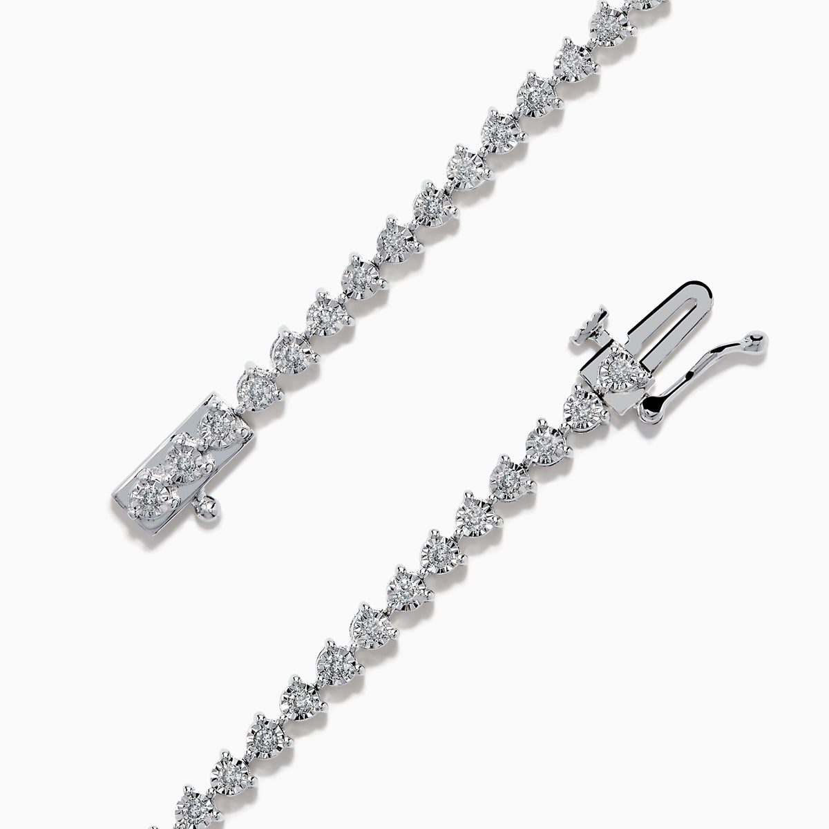 The 14K White Gold Diamond Miracle Setting Tennis Bracelet features a continuous line of round-cut diamonds set in white gold, displayed against a plain white background.